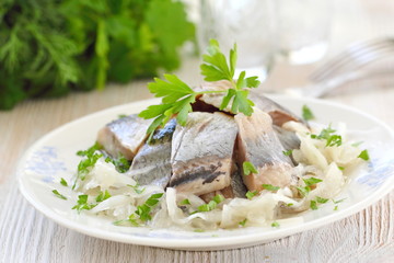 Salted herring fillet with oil, marinated onion and fresh parsley - obrazy, fototapety, plakaty