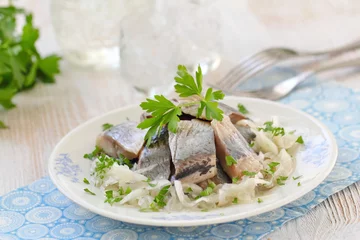 Fotobehang Salted herring fillet with oil, marinated onion and fresh parsley © lisa870