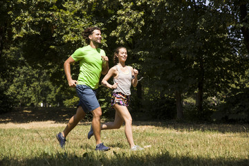 Young couple running in nature