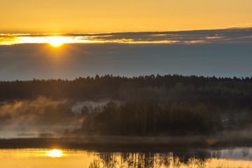 Sunrise over the lake Pozezdrze on Masuria, Poland