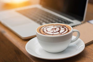 late art hot coffee on wooden floor
