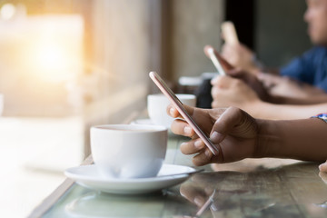 many hand using smartphone in coffee shop