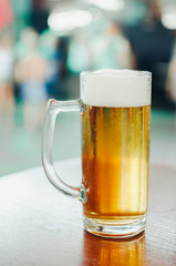 Beer glass on the table in the cafe