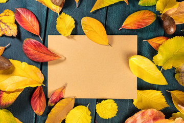 Autumn leaves on brown kraft paper with copyspace