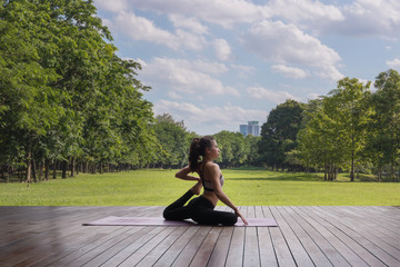 Attractive woman Playing yoga For her good health