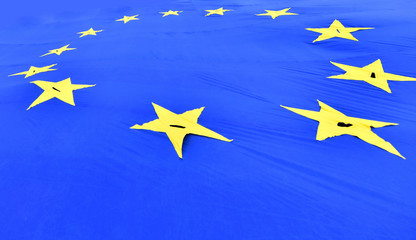 Big waving European Union flag with yellow stars made of fabrics