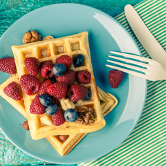 Homemade waffles with raspberries and blueberry