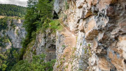 Impressive views of the European mountains with white clouds and blue skies