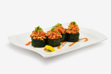 Spicy salmon shushi, Spicy salmon rolls in white plate on white background