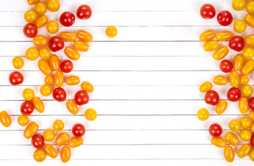 Different tomatoes on white wooden table. Top view