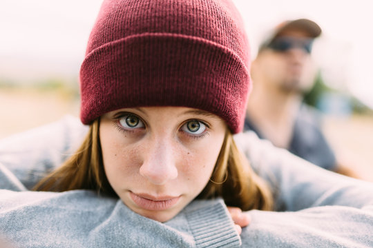 Serious Teenager with a Red Wool Hat
