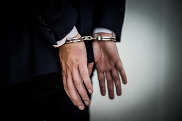 Businessman arrested with handcuffs on back for corruption and stealing millions of dollar euro...