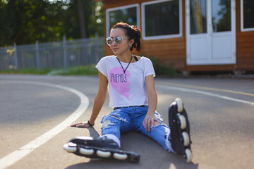 Summer girl in Park rollerblading