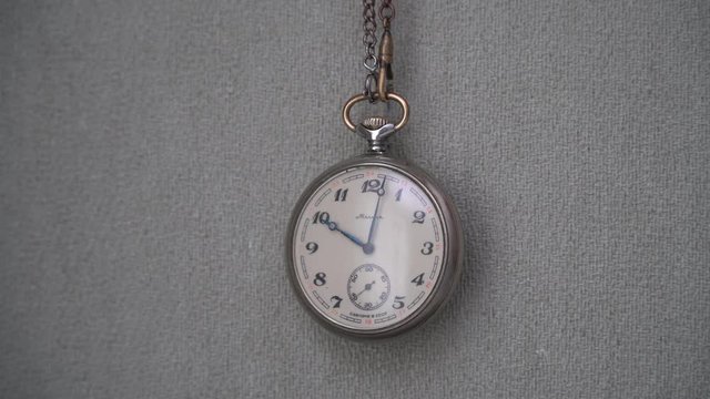 Pocket watch on a chain. Timelapse 8x