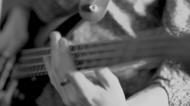 Jazz Bassist playing in Black and white