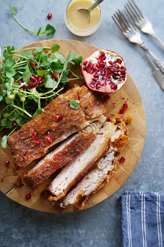 14 hours slow roasted pork belly with watercress and pomegranate salad.