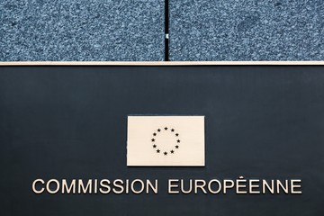 European commission sign on a wall