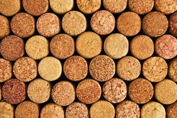 Background from textured wine corks closeup, top view.