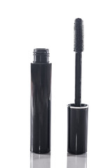 Black mascara with applicator brush isolated on white