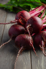 Bunch of fresh organic beets on rustic wooden table, selective focus