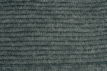 gray color wool knitted fabric background texture