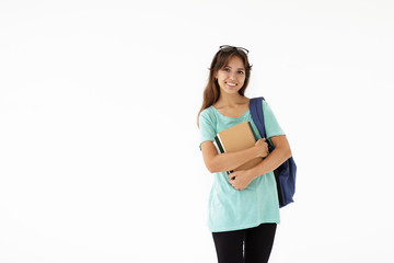 People, lifestyle, learning and education concept. Beautiful young female college student with rucksack posing in studio holding books from library, going to prepare report for history lesson
