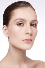 Young beautiful woman with radiant skin and clean make-up