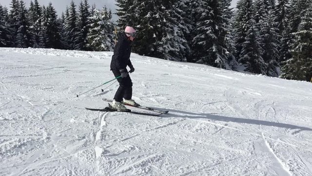 Skier on a slope, young female
