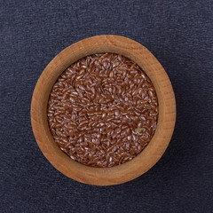 Flax seed in a wooden bowl