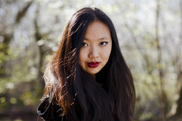 Naklejka premium Portrait of beautiful Chinese girl with long black hair