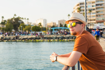 Man in sunglasses in seashore