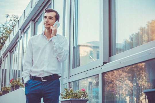 Young Buisnessman Talking On The Phone