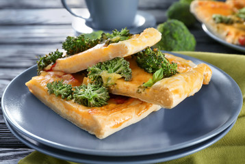 Traditional quiche with broccoli and cheese on plate