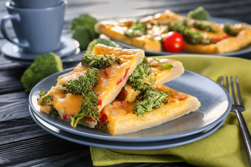 Traditional quiche with broccoli and cheese on plate