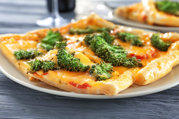 Traditional quiche with broccoli and cheese on plate