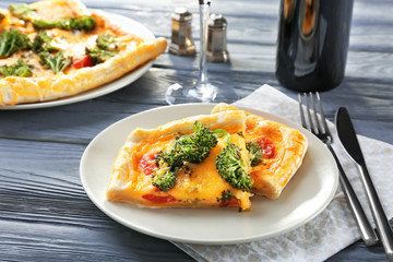 Traditional quiche with broccoli and cheese on plate