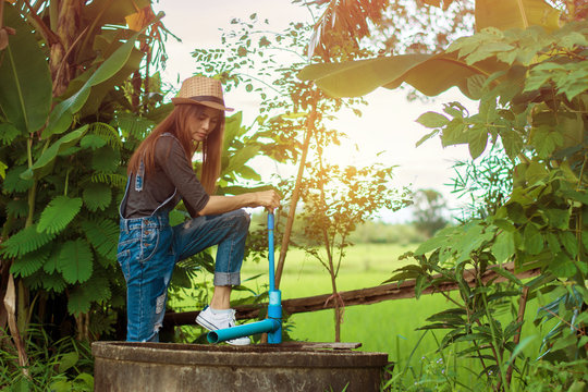 Woman Construction Worker,Repairing A Broken Water Pipe In Garden.