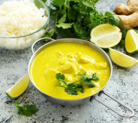 Yellow curry with chicken and rice. Asian cuisine.