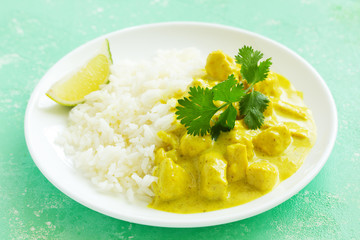 Yellow curry with chicken and rice. Asian cuisine.