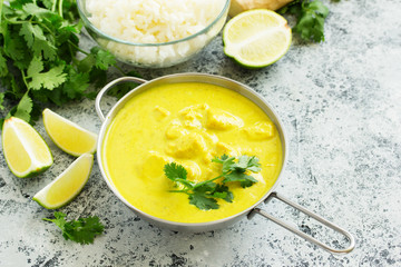 Yellow curry with chicken and rice. Asian cuisine.