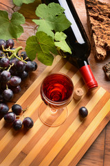 Glass of red wine - wood background