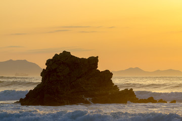 Sunset reflection in the ocean on Arrietara beach, Atxabiribil Sopelana, Basque Country (Euskadi), Spain