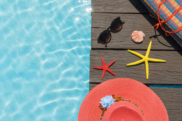beach accessories on the shore of the pool on a Sunny day