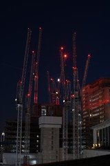 Fototapeta na wymiar Night time cranes