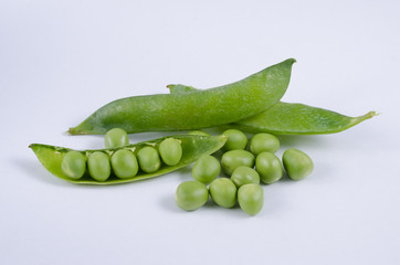Fresh green pea pod on white background