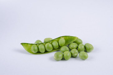 Fresh green pea pod on white background