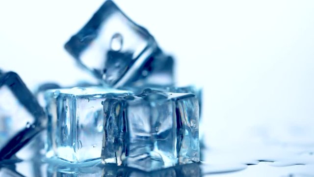 Ice cube. Closeup of melting ice cubes. Rotation 360 degrees. 4K UHD video footage. Ultra high definition 3840X2160