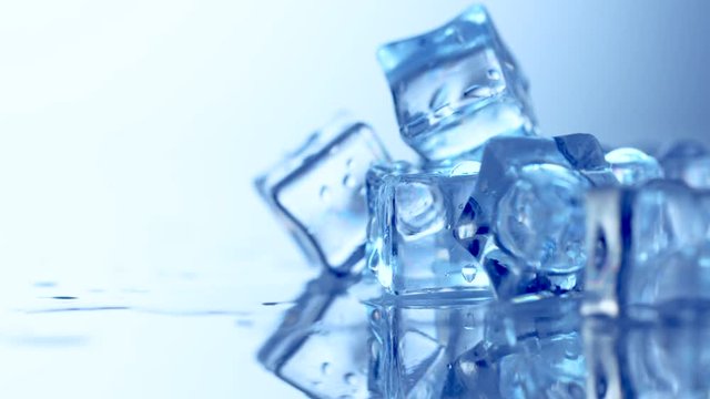Ice cube. Closeup of melting ice cubes. Rotation 360 degrees. 4K UHD video footage. Ultra high definition 3840X2160