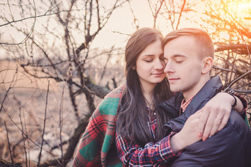 Fototapeta premium Young couple in love walking in the autumn park