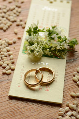 Fototapeta na wymiar Gold wedding rings on the calendar